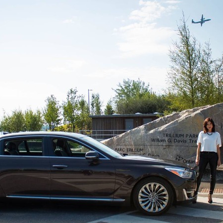 The photo of Cindy Sampson posing with her car.